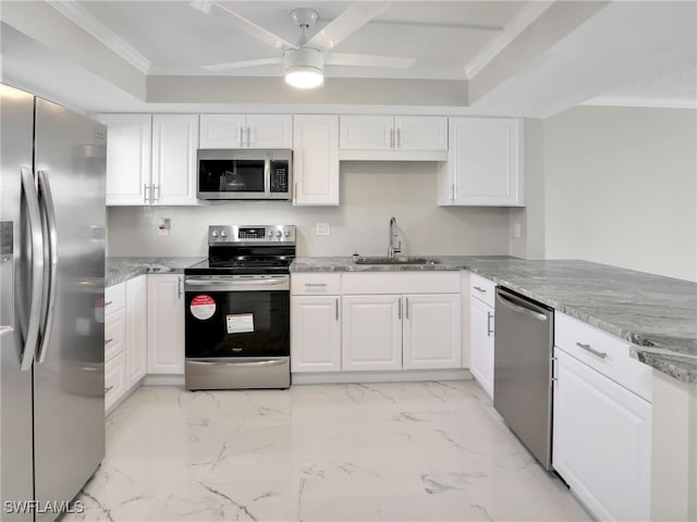 kitchen with sink, crown molding, stainless steel appliances, white cabinets, and light stone countertops