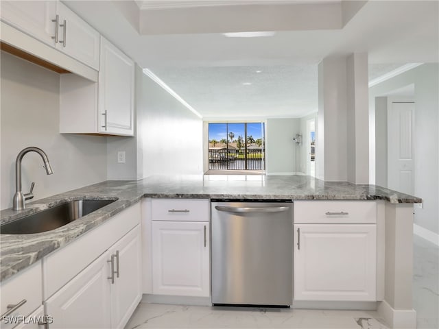 kitchen with white cabinets, sink, dishwasher, and kitchen peninsula