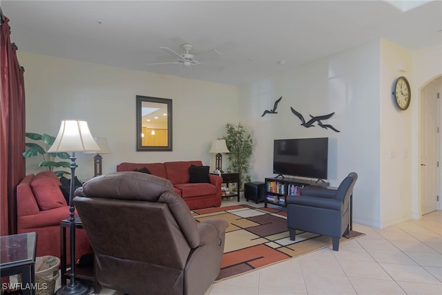 tiled living room featuring ceiling fan