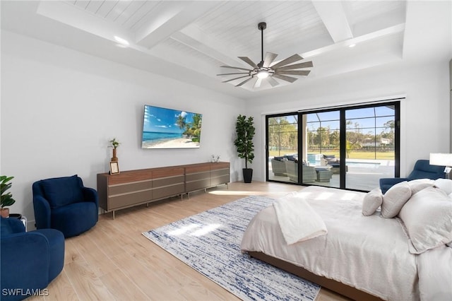 bedroom featuring ceiling fan, access to outside, beamed ceiling, and light wood-type flooring