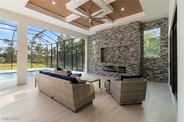 view of patio with ceiling fan, an outdoor hangout area, and a lanai