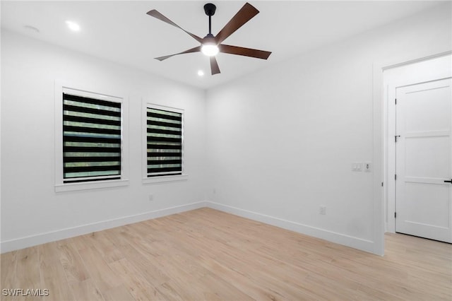 unfurnished room with ceiling fan and light hardwood / wood-style floors