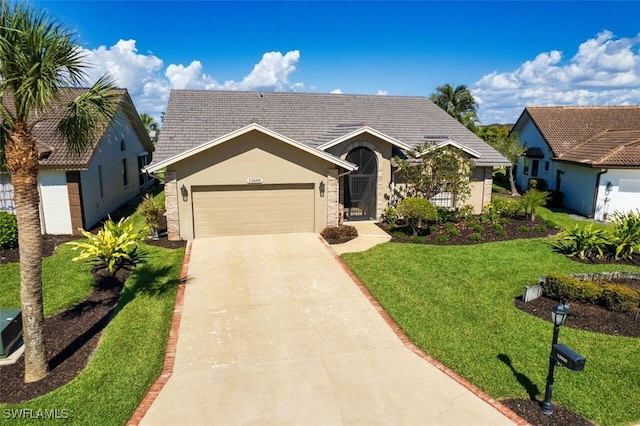 ranch-style home featuring a garage and a front yard