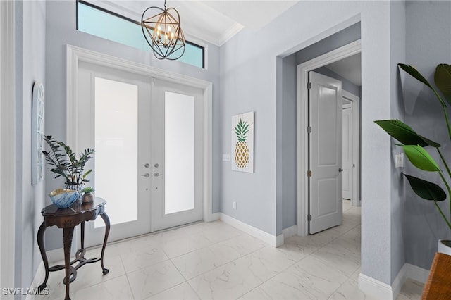 142 SW 35th Ave, Cape Coral, FL 33991 - entryway featuring french doors, ornamental molding, and a notable chandelier