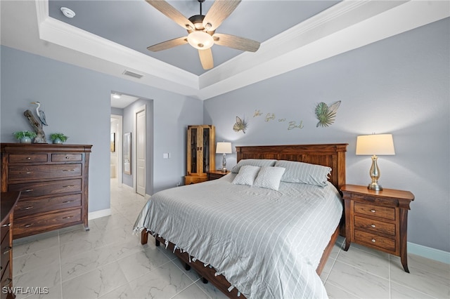 142 SW 35th Ave, Cape Coral, FL 33991 - bedroom featuring crown molding, ceiling fan, ensuite bath, and a tray ceiling
