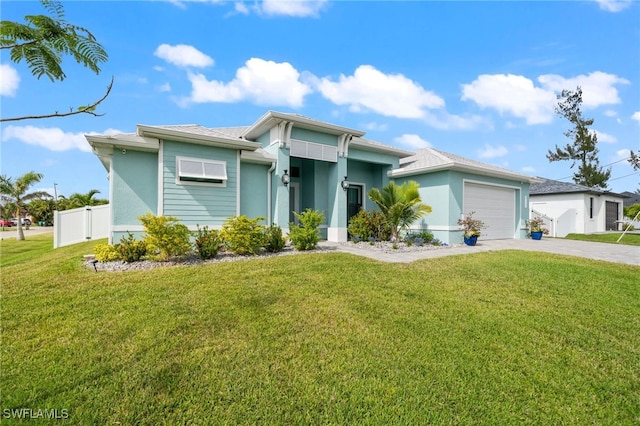 view of front of house with a garage and a front yard