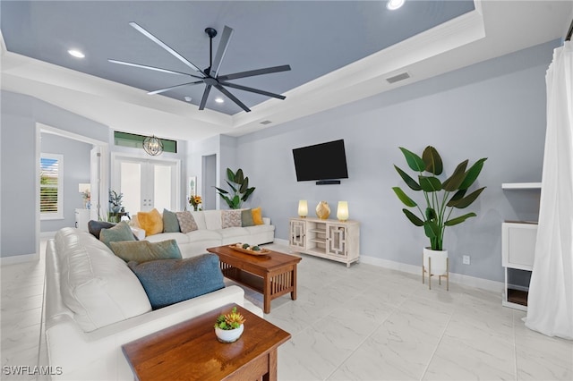 142 SW 35th Ave, Cape Coral, FL 33991 - living room with french doors, crown molding, ceiling fan, and a tray ceiling