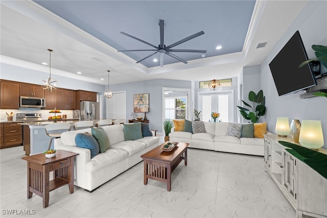 142 SW 35th Ave, Cape Coral, FL 33991 - living room with crown molding, ceiling fan, and a raised ceiling
