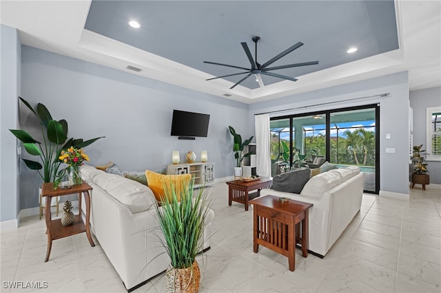 142 SW 35th Ave, Cape Coral, FL 33991 - living room with ceiling fan and a raised ceiling