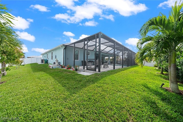142 SW 35th Ave, Cape Coral, FL 33991 - rear view of house with a yard, a lanai, and a patio area