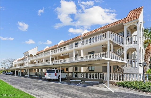 view of property featuring covered parking