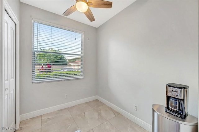 spare room featuring ceiling fan