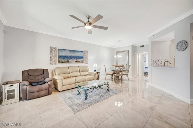 living room featuring sink, ornamental molding, and ceiling fan