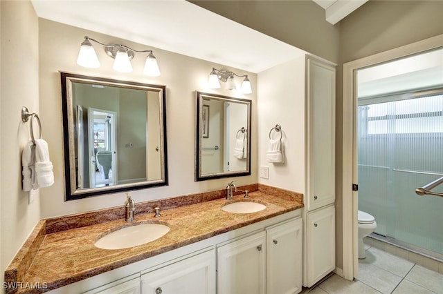 14899 Crescent Cove Dr, Fort Myers, FL 33908 - full bathroom with toilet, tile patterned floors, and double vanity