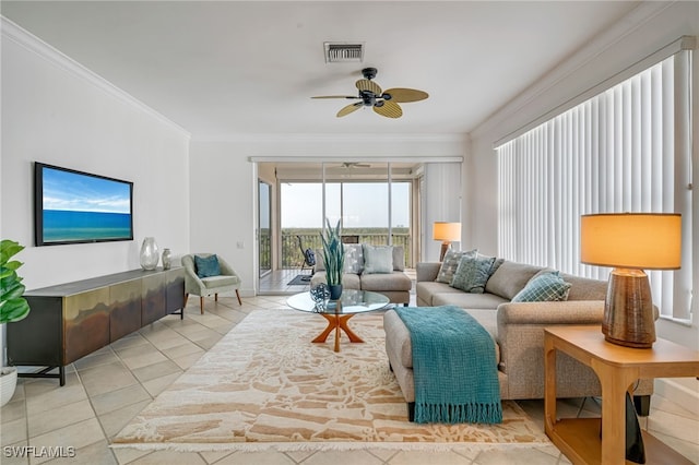 living room featuring crown molding, ceiling fan, and light tile patterned flooring