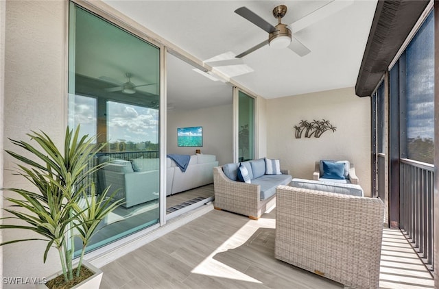 interior space featuring an outdoor living space and ceiling fan