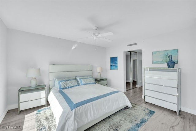 bedroom featuring light hardwood / wood-style flooring and ceiling fan