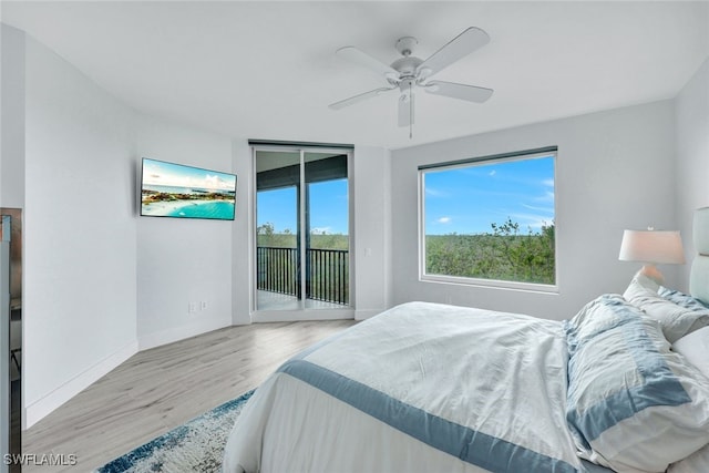 bedroom featuring ceiling fan, access to exterior, and light wood-type flooring