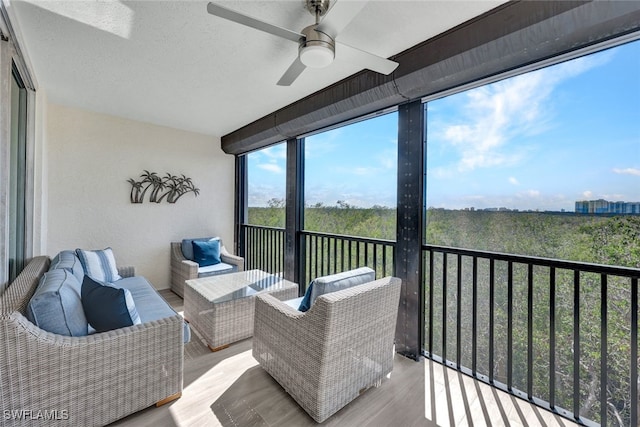 balcony featuring ceiling fan