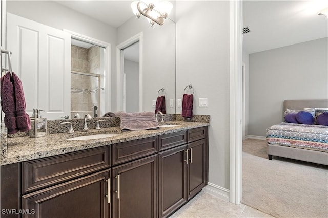 bathroom with vanity, tile patterned floors, and walk in shower