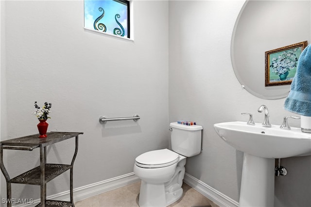 bathroom with tile patterned floors and toilet