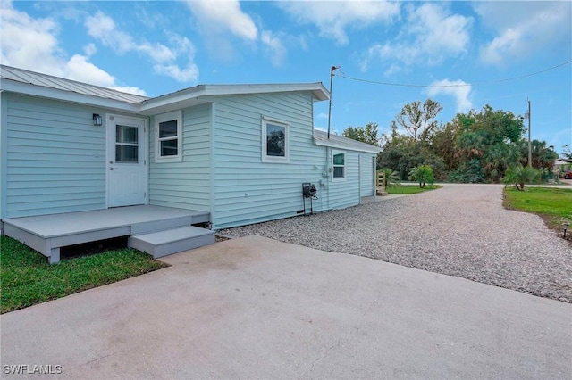 view of side of home featuring a patio