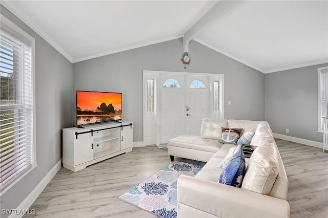 living room featuring vaulted ceiling with beams, crown molding, and light wood-type flooring