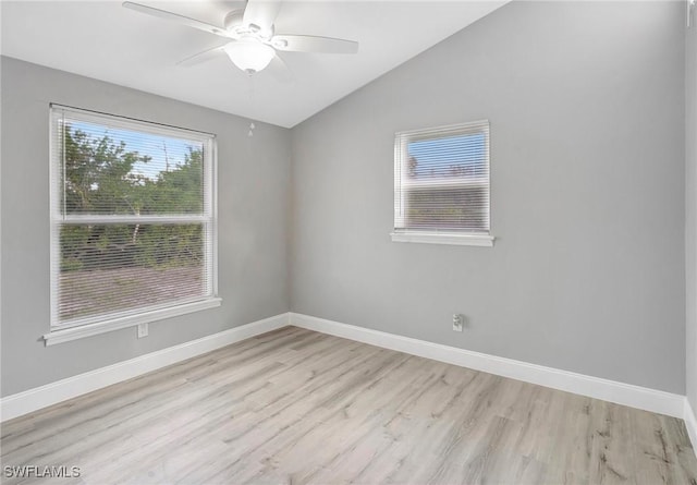 unfurnished room featuring lofted ceiling, ceiling fan, and light hardwood / wood-style flooring