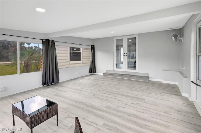 unfurnished sunroom featuring french doors