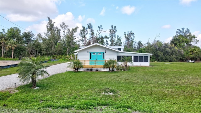 view of front of house featuring a front yard and covered porch