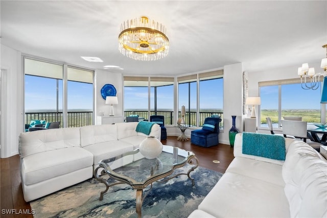 living area with dark wood-style floors and a chandelier