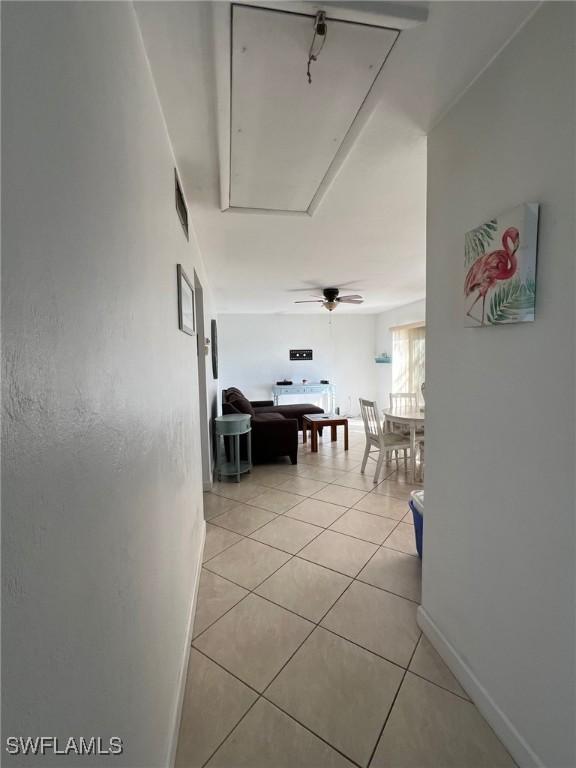 hallway with light tile patterned floors