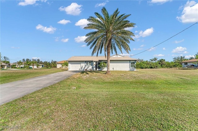 single story home featuring a garage and a front yard