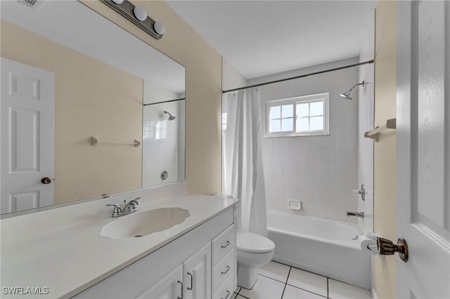 full bathroom with tile patterned flooring, vanity, shower / bath combo with shower curtain, and toilet