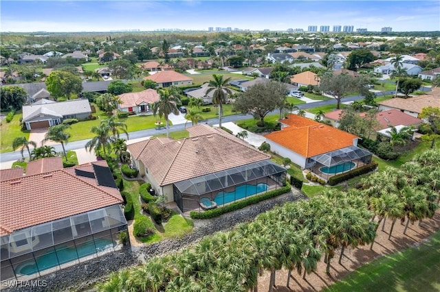 birds eye view of property with a residential view