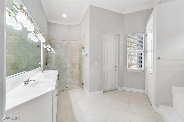 bathroom featuring baseboards, ornamental molding, a marble finish shower, a sink, and tile patterned flooring