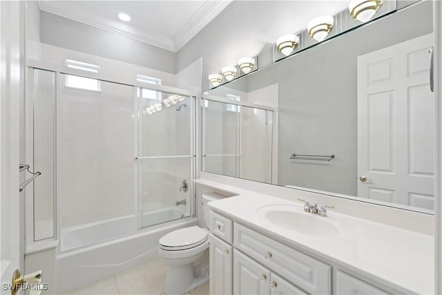 full bath with crown molding, vanity, tile patterned flooring, combined bath / shower with glass door, and toilet