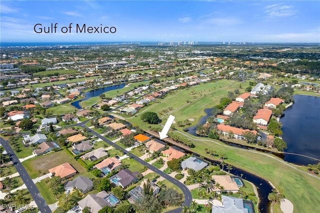 bird's eye view featuring a water view and a residential view