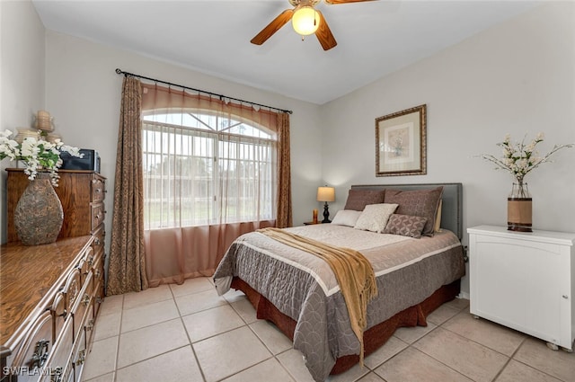 tiled bedroom with ceiling fan