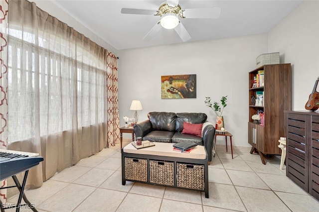 living room featuring light tile patterned floors and ceiling fan