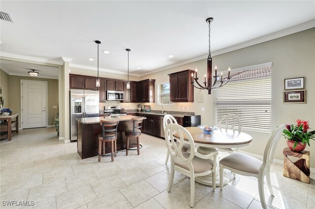 14558 Manchester Dr, Naples, FL 34114 - dining room featuring crown molding, a chandelier, and sink