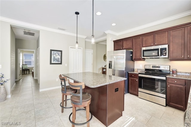 14558 Manchester Dr, Naples, FL 34114 - kitchen with light stone counters, stainless steel appliances, decorative light fixtures, and a kitchen island