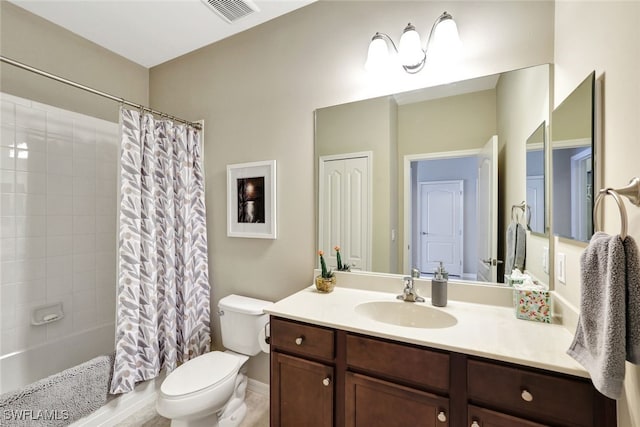 14558 Manchester Dr, Naples, FL 34114 - full bathroom with vanity, toilet, and shower / bath combo