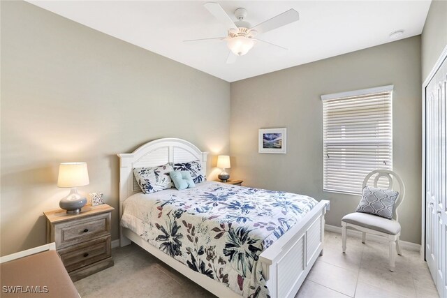 14558 Manchester Dr, Naples, FL 34114 - tiled bedroom with ceiling fan and a closet