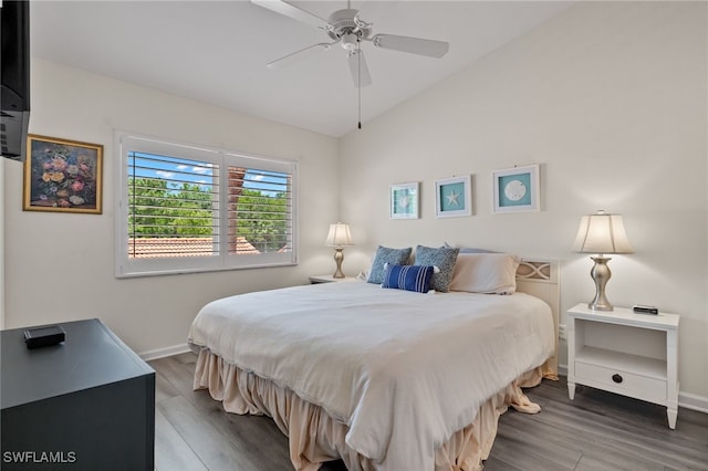 bedroom featuring vaulted ceiling, wood-type flooring, and ceiling fan