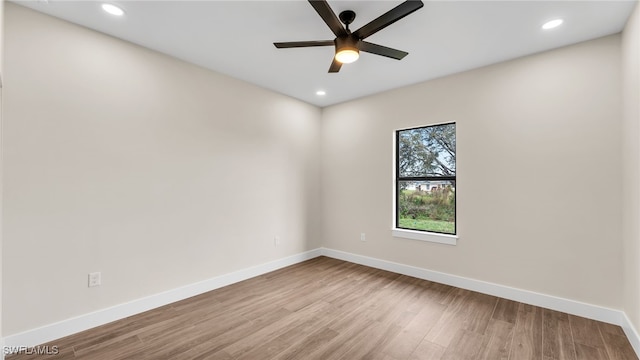 unfurnished room featuring ceiling fan and light hardwood / wood-style flooring