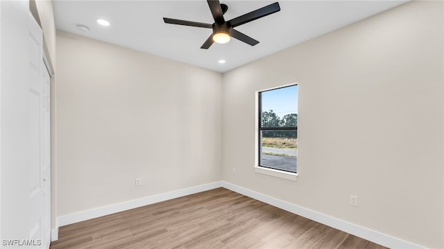 unfurnished room with ceiling fan and light hardwood / wood-style floors