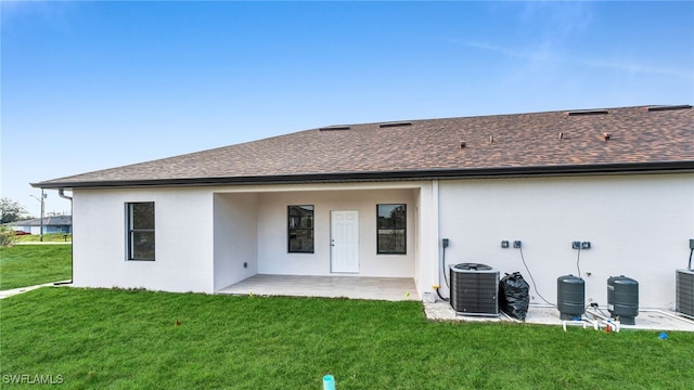 back of house featuring a yard and a patio