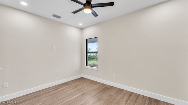 spare room featuring ceiling fan and light wood-type flooring