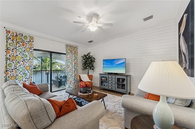 9517 Avellino Way Unit 2224, Naples, FL 34113 - living area featuring ceiling fan, ornamental molding, vaulted ceiling, and wooden walls